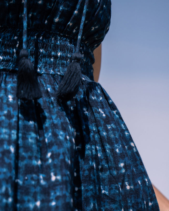 Close-up of notch neckline and lightweight fabric