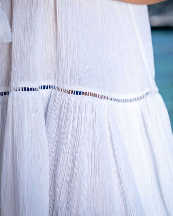 Close-up of tassel neckline on Gari dress